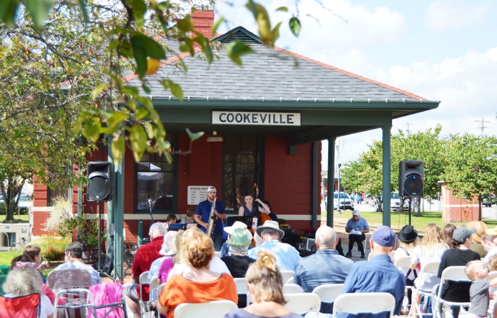 People gather for a Brown Bag Lunch Concert at the Cookeville Depot.