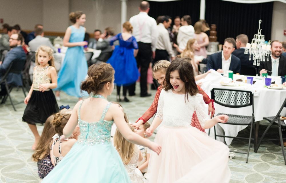 Girls dance during Father-Daughter Date Night.