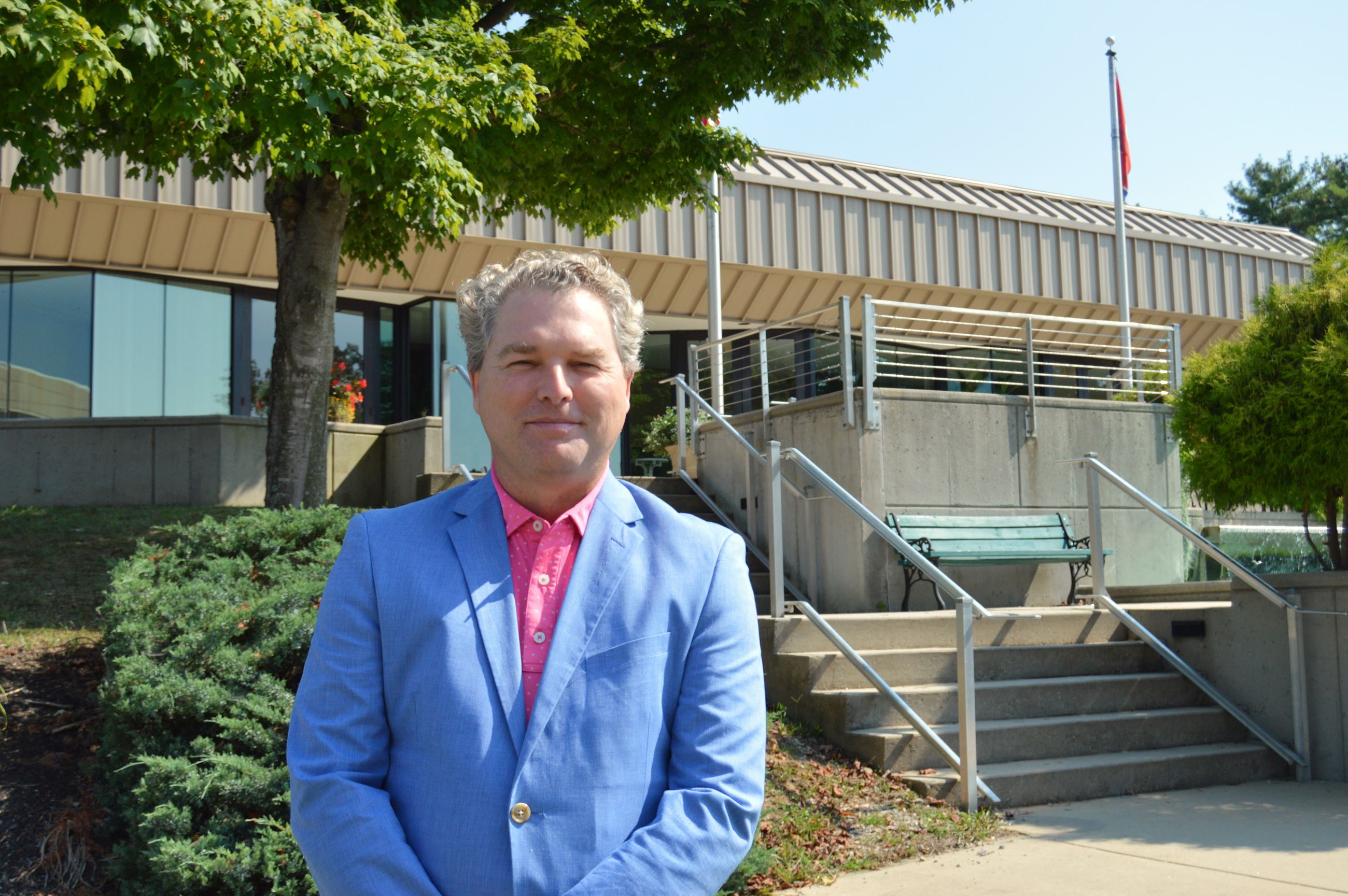 Chad McDonald stands in front of the Performing Arts Center