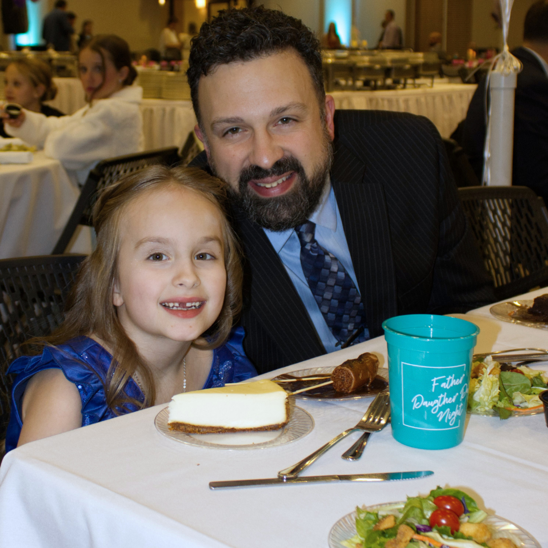 dad and daughter dressed up at a nice dinner event