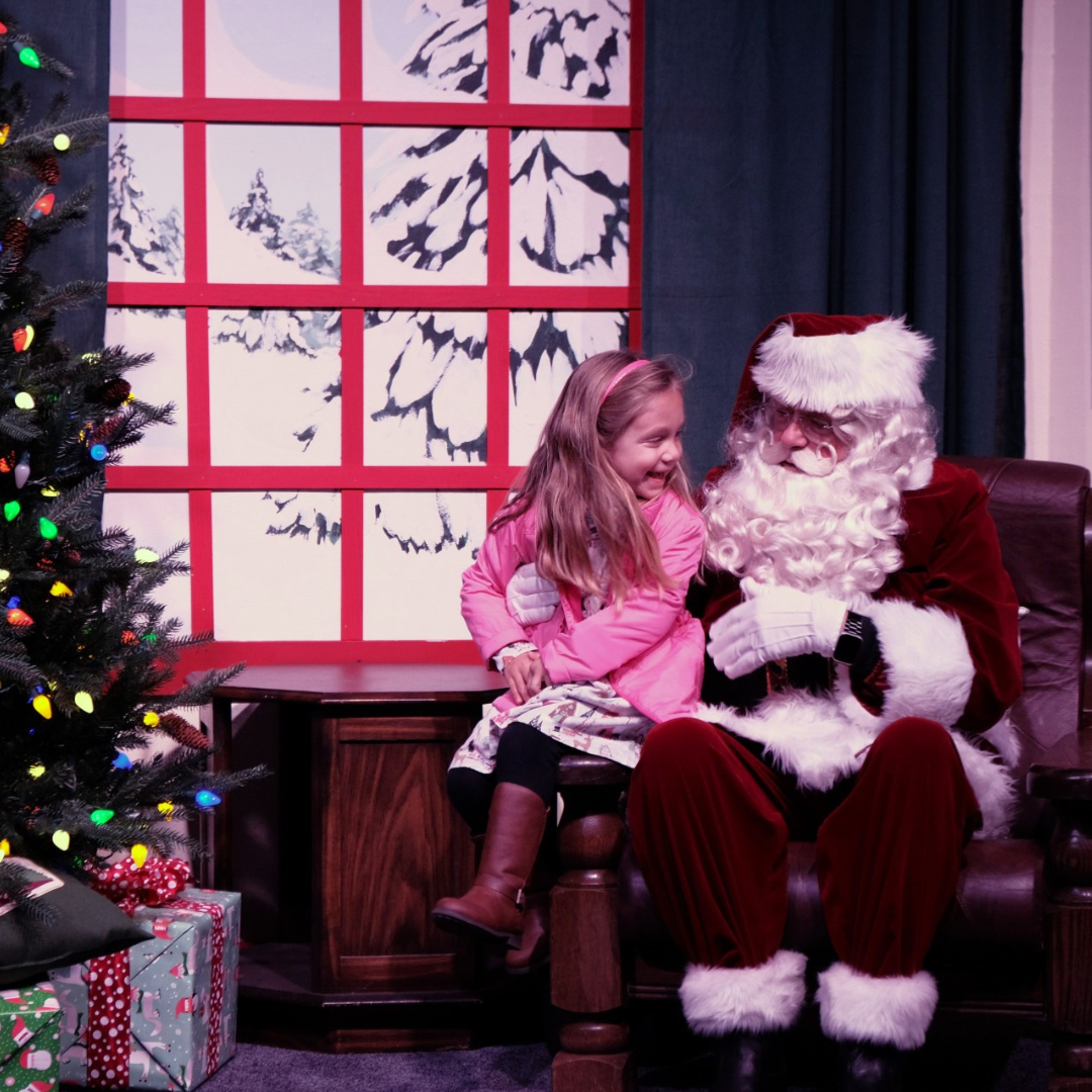 child sitting in santas lap